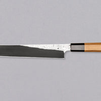 Nigara Kurozome Kiritsuke Yanagiba Aogami #2 Damascus 240 mm tradicionalni je japanski nož koji se koristi za pripremu ribe (osobito za sašimi i nigiri suši). Duga oštrica omogućuje lijepe i duge pokrete, a podrezan vršak precizan završetak reza.
