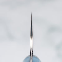 Choil. Nigara Santoku SG2 Migaki Tsuchime Turquoise 180 mm višenamjenski je japanski kuhinjski nož, pogodan za pripremu mesa, ribe i povrća. Jezgra od SG2 praškastog čelika i hamaguri presjek profila osiguravaju dugotrajnu oštrinu i minimalno održavanje.