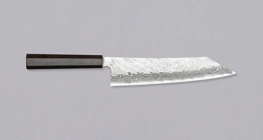 Nigara Kiritsuke Gyuto VG-10 Damascus Tsuchime višenamjenski je japanski kuhinjski nož pogodan za pripremu mesa, ribe i povrća. Jezgra od nehrđajućeg čelika VG-10 garancija je za  dugotrajnu oštrinu i minimalno održavanje. Iznimne karakteristike i izgled noža nadopunjuje drška wa tipa, izrađena od luksuzne ebanovine.