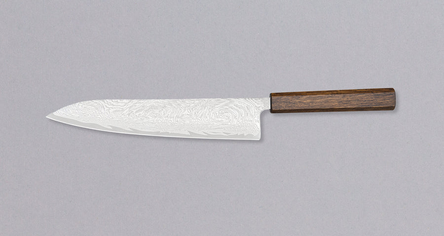 Tsunehisa Gyuto AUS-10 Nami 240 mm višenamjenski je japanski kuhinjski nož, prikladan za pripremu mesa, ribe i povrća. Izvrstan je odabir za sve one koji traže nož s malo dužom oštricom koji će bez poteškoća razrezati veće komade mesa ali iskazat će se i kao slicer nož. AUS-10 je nehrđajući čelik s finom oštrinom.