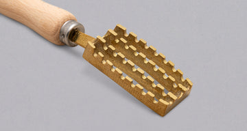 Pribor za odstranjivanje ljuski Tsunehisa